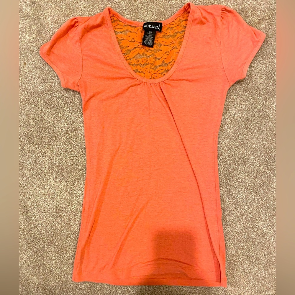 This wetSeal top with a lacy back is a beautiful peachy color with an size XS